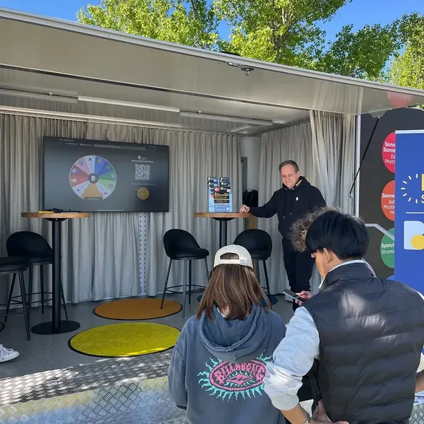 Visitors at the Burgenland Energie Spin the Wheel game, controlled by phone