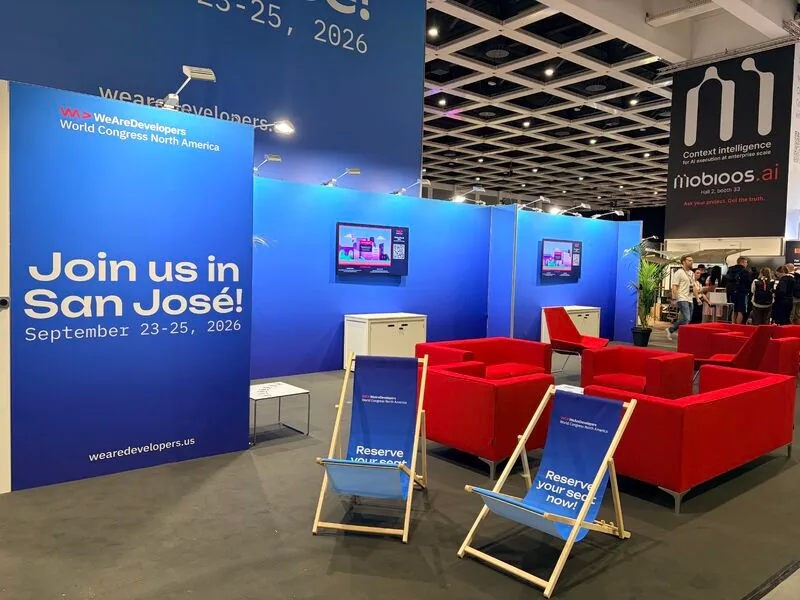 WeAreDevelopers San Jose booth with QR screens and lounge furniture at the World Congress in Berlin