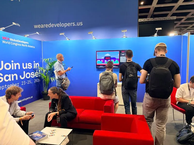 Visitors at the San Jose booth with screen and QR activation for Road to San Jose